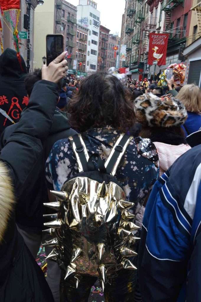 Man with spiky backpack