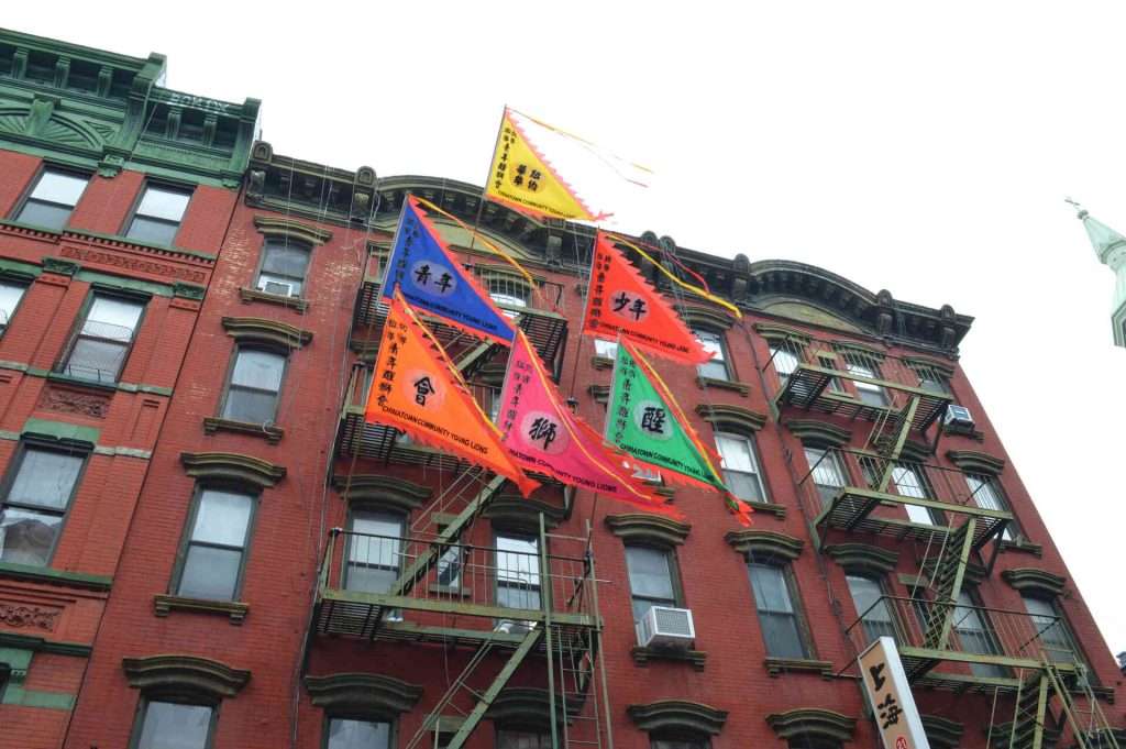 Colorful flags hanging from building